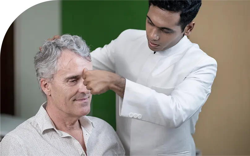 Ayurvedic Practitioner Treating Patient